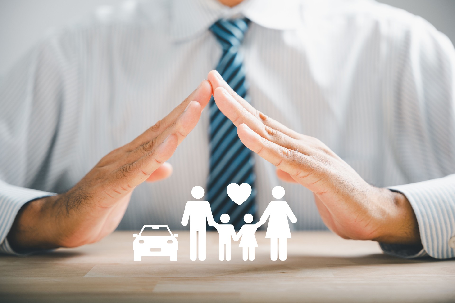 Hands with protective gesture and family